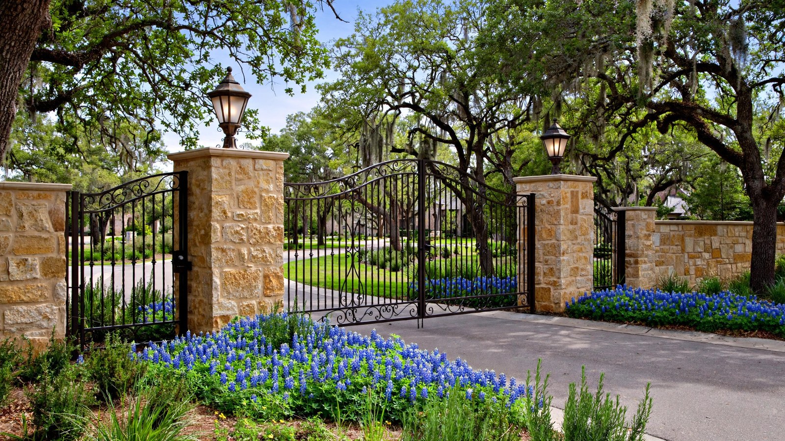 Stone gated entrance with iron gates in Enclave at Lakeview, Little Elm TX